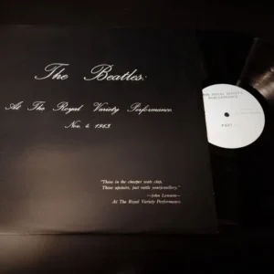 A record sitting on top of a black sheet.