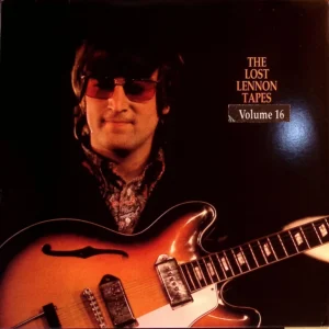 A man with sunglasses and a guitar.