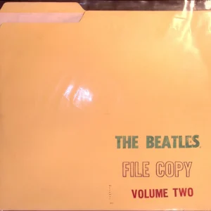 A yellow file folder with the beatles ' album cover on it.