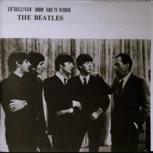 A black and white photo of the beatles