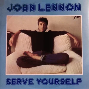 A man sitting on top of a couch.