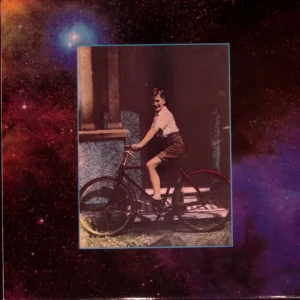 A person on a bicycle in front of some space
