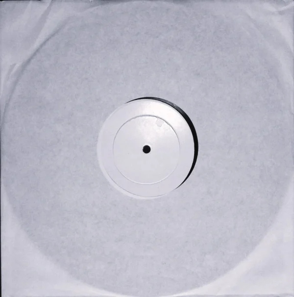 A white record with a black dot on the bottom.