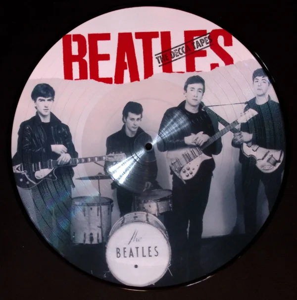 A picture of the beatles on a disc.