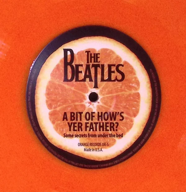 A beatles record is shown on an orange background.