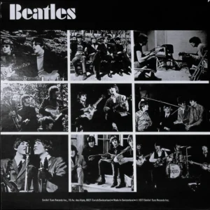 A black and white photo of the beatles