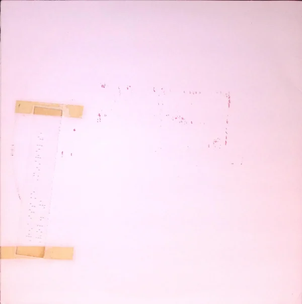 A white wall with some yellow clothespins on it