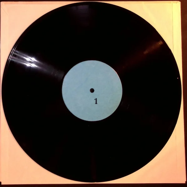 A black and white record is on the table.