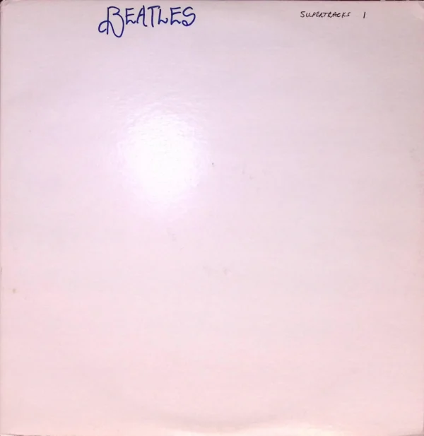 A white sheet with the word beatles written in blue ink.