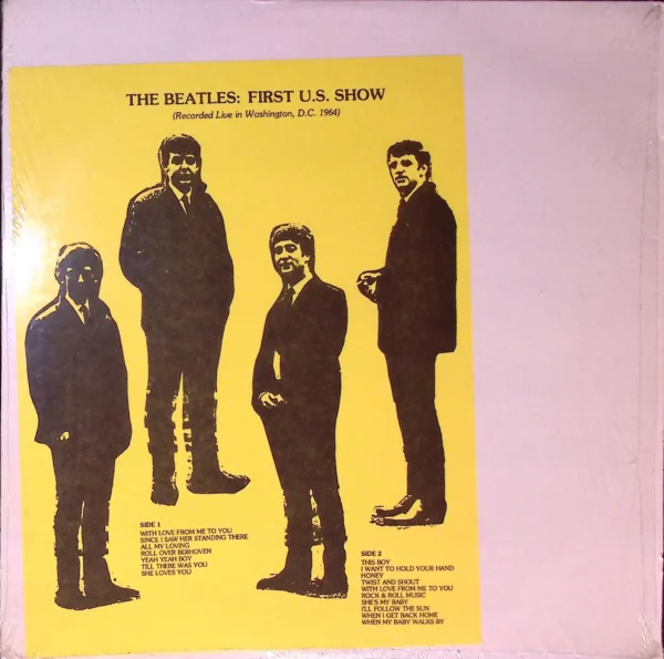 A poster of the beatles in their suits.