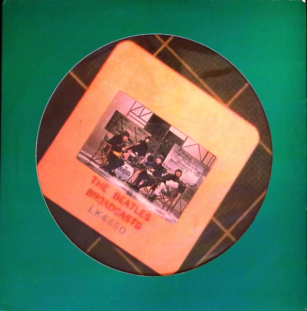 A picture of the beatles on a coaster.