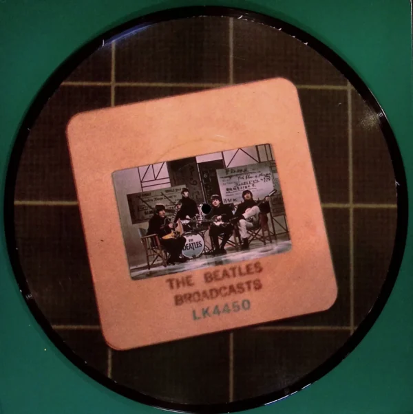 A picture of the beatles on a coaster.