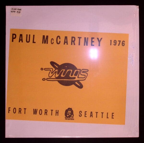 A poster of the band paul mccartney in 1 9 7 6.