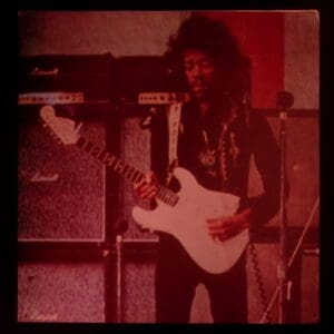 Jimi Hendrix playing electric guitar.