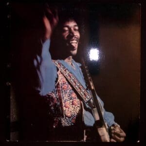Jimi Hendrix performing on stage.