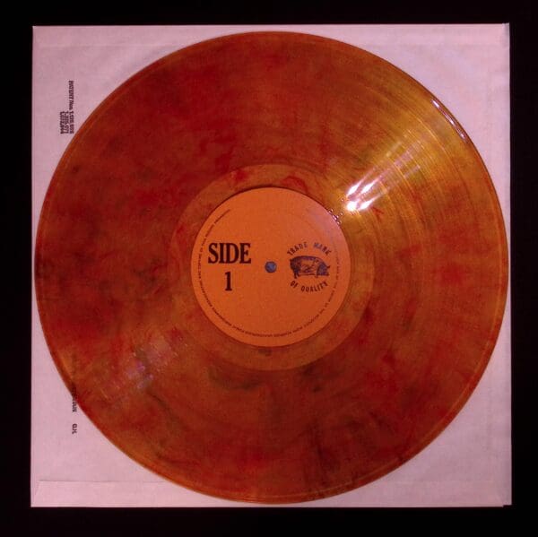 Side one of orange vinyl record.