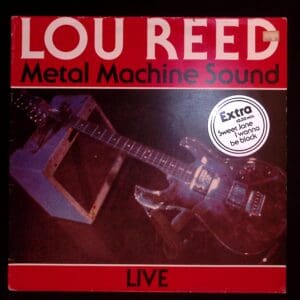 A red and black album cover with an electric guitar.
