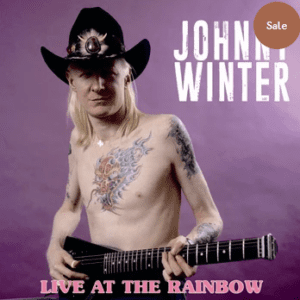 Musician with guitar, tattoos, and cowboy hat.