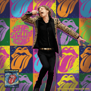 Singer performing with colorful tongue backdrop.