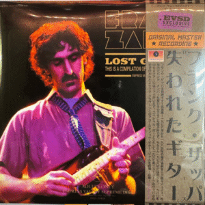 Musician playing guitar on album cover.