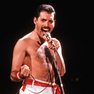 Singer performing passionately with microphone on stage.