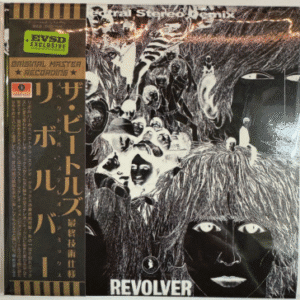 Collage-style album cover with abstract faces.