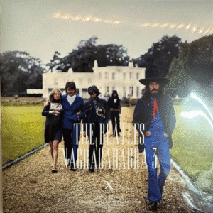 People walking in front of a mansion.