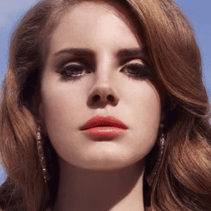 Woman with red lipstick and earrings.
