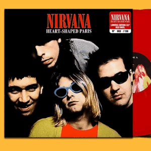 Nirvana band members posing with their album Heart-Shaped Box cover.
