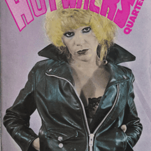 Punky woman with blonde hair in a black leather jacket.