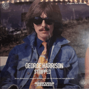 George Harrison wearing sunglasses and a denim jacket, playing guitar outdoors.
