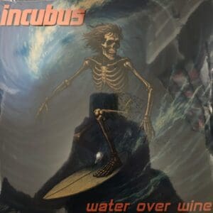 A skeleton riding a whale underwater on Incubus's Water Over Wine album cover.